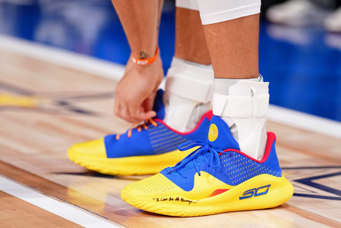 Stephen Curry's blue and gold Under Armour sneakers worn in the 2024 NBA All-Star Game.